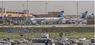  ?? — AFP ?? EXTREMIST THREAT : Egypt Air planes sit on the tarmac at Cairo internatio­nal airport on Wednesday hours after the US government warned that extremists plan to target passenger jets with bombs hidden in electronic devices.