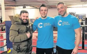  ??  ?? Jonathan (centre) with his trainer Jamie Stranger (left) and corner man Gaz Simpson