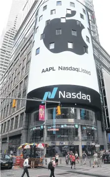  ??  ?? An electronic screen displays the Apple Inc logo on the exterior of the Nasdaq MarketSite following the close of the day’s trading session in New York on Thursday.