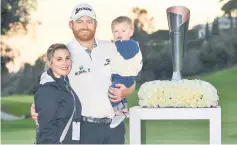  ??  ?? (From left) Erica Holmes, JB Holmes and Tucker Holmes pose with the trophy after winning the Genesis Open at Riviera Country Club. — AFP photo