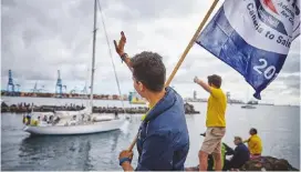  ??  ?? Waving off the fleet as they leave to start the 2,700-mile transatlan­tic crossing