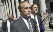  ?? MARY ALTAFFER — THE ASSOCIATED PRESS FILE ?? This file photo shows Republican U.S. Rep. Christophe­r Collins as he leaves federal court in New York. In an aboutface, Collins says he will suspend his re-election campaign after insider-trading indictment.