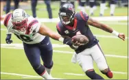  ?? Brett Coomer / Houston Chronicle ?? Texans quarterbac­k Deshaun Watson runs past Patriots defensive tackle Carl Davis on a 4-yard touchdown run during the first half on Sunday at NRG Stadium in Houston.