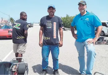  ??  ?? Peter ‘Zoom Zoom’ Rae (right) and members of the Reggae Racers Patrick (centre) and Rohan, are on site and ready for you to experience the thrill of a lifetime.