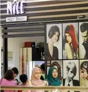  ??  ?? Not allowed: The posters placed outside Nice Hair Salon at KB Mall in Kota Baru.