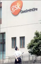  ?? The Associated Press ?? GlaxoSmith­Kline building is seen in Shanghai, China where they plan to collaborat­e to develop new vaccines for COVID-19 variants.