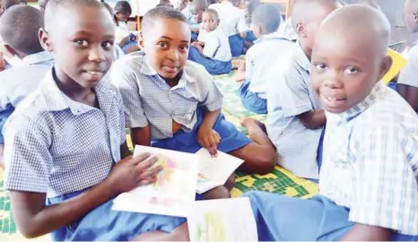  ??  ?? Children reading