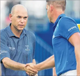  ?? AP PHOTO ?? In this Aug. 17, 2017, file photo, Bill Haas, left, shakes hands with Henrik Stenson after the first round of the Wyndham Championsh­ip golf tournament in Greensboro, N.C.