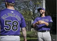  ?? ?? Justin Lawrence (61) jokes with Lucas Gilbreath (58) of the Colorado Rockies during Spring Training at Salt River Fields in Scottsdale, Arizona on Wednesday, Feb. 21, 2024.