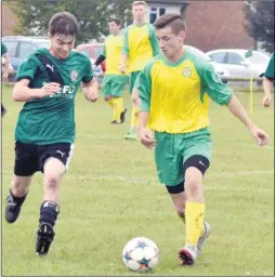  ?? Pictures: tracey corps ?? Ashford United Colts, yellow, take on Troggs Reserves during their 4-0 win in Division 3