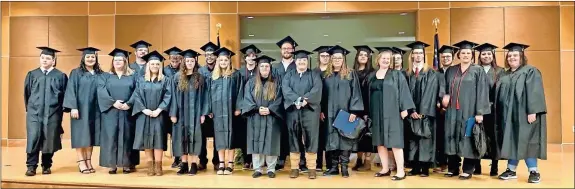  ?? Contribute­d ?? Graduates of GNTC’s Adult Education program line up for a photo after the commenceme­nt ceremony held on the Gordon County Campus for students who have earned their GED diplomas.