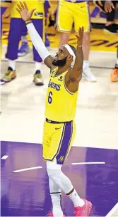  ?? GETTY IMAGES ?? LeBron James celebrates after passing Kareem Abdul-Jabbar to become the NBA’s all-time leading scorer on Tuesday in Los Angeles.