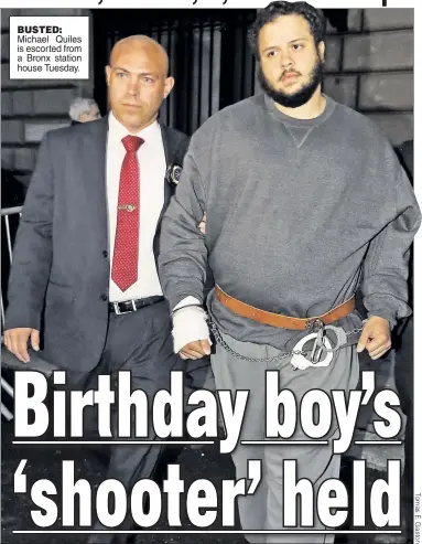  ??  ?? BUSTED: Michael Quiles is escorted from a Bronx station house Tuesday.