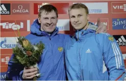  ??  ?? INNSBRUCK: In this Saturday, Jan. 18 2014 file photo Russia’s third placed Alexander Zubkov, left, and Dmitry Trunenkov pose for media after the two-men bob race at the Bob World Cup in Innsbruck, Austria. The Russian Anti-Doping Agency said yesterday...