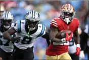  ?? EAKIN HOWARD — GETTY IMAGES ?? The 49ers’ Jeff Wilson Jr. runs the ball against the Carolina Panthers during the first quarter on Sunday in Charlotte.