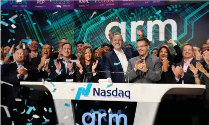  ?? ?? The Arm chief executive Rene Haas, middle, rings the opening bell at the Nasdaq in New York on Thursday. Photograph: Richard Drew/AP