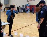  ?? ?? Mott senior Nyla Tate attempts to pass a sobriety test while wearing goggles that make her feel like she is drunk or high.