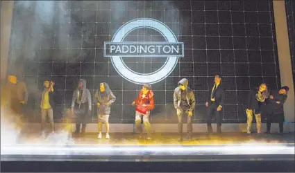  ?? Joan Marcus ?? ALEXANDER SHARP, center, is a quirky teen with an exceptiona­l brain in “The Curious Incident of the Dog in the Night- Time.”