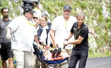  ?? PHILIPPE LOPEZ/AFP ?? Australia’s Richie Porte is evacuated after falling on the 181.5km ninth stage of the 104th edition of the Tour de France between Nantua and Chambery on Sunday.