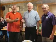  ?? SUBMITTED PHOTOS ?? Outgoing Bally Lions Club president Matt Gehringer, left, handed over the club’s gavel to new president Fred Kroncke, who was officially installed by past District Governor Lion Gary Hilbert, right. Kroncke also received this year’s Lion of the Year Award.