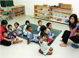  ??  ?? Story time: Pre-school children having their morning sessions.