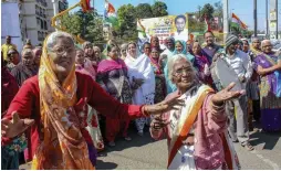  ?? — PTI ?? Elderly women activists celebrate the increase in their social security pension to ` 600 by the Madhya Pradesh government in Bhopal on Saturday.