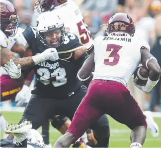  ?? Cliff Grassmick, Daily Camera ?? Javier Edwards, mixing it up against Arizona State on Saturday, is Colorado’s man in the middle, doing the “dirty work” to enable teammates to make tackles.