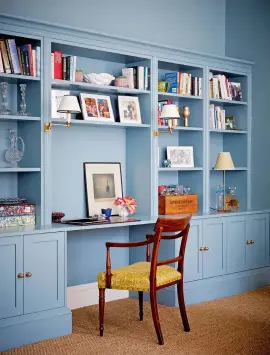  ??  ?? DRAWING ROOM Jessica encouraged her clients to paint the cabinetry the same colour as the walls for a chic uniform look. Cabinetry designed by Jessica Buckley Interiors;
painted in Oval Room Blue, Farrow & Ball.
Antique chair covered
in Fortuny fabric