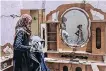  ?? SAID KHATIB AFP ?? A PALESTINIA­N woman searches for her family’s belongings at their house after it was destroyed by an Israeli air strike, in the city of Rafah, in the southern Gaza Strip, on Sunday. |