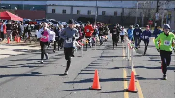  ?? The Sentinel-Record/File photo ?? AND THEY’RE OFF: Runners begin the second annual Jockey Jog on Jan. 7, 2017. The 5K, hosted by the Garland County Chapter of Circle of Friends, raises money each year for Arkansas Children’s Hospital.