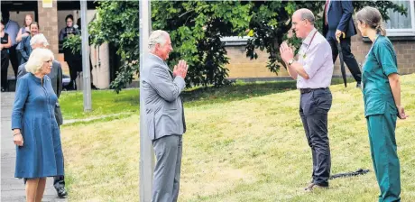  ??  ?? Prince Charles remains socially distanced as he a performs a namaste to Professor Mark Pietroni as he arrives with Camilla, Duchess of Cornwall
Pictures: Ben Birchall/pa Wire