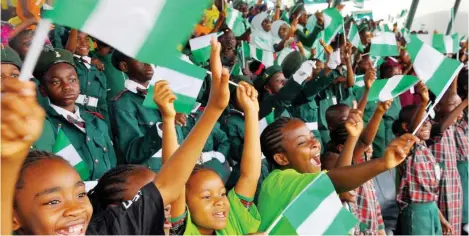  ?? Photo: Felix Onigbinde ?? Students cheer over a spectacula­r display at the 58th Nigeria Independen­ce Day celebratio­n in Abuja yesterday