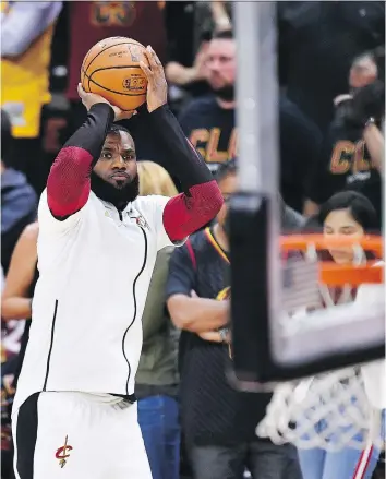  ?? GETTY IMAGES ?? LeBron James warms up before Game 3 Wednesday in Cleveland. James averaged 40 points, 10 assists and nine rebounds in two games in Oakland, but the Cavs still lost both games to the Golden State Warriors.