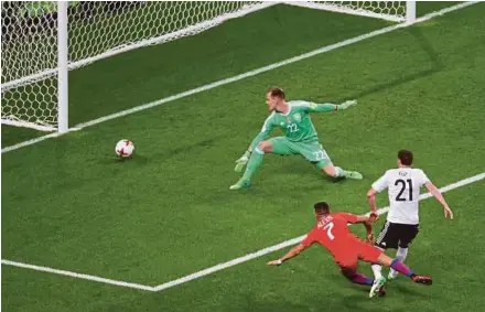  ?? AFP PIC ?? Chile’s Alexis Sanchez scores the historic goal past Germany goalkeeper Marc-Andre Ter Stegen in a Confederat­ions Cup Group B match on Thursday. The match ended 1-1.