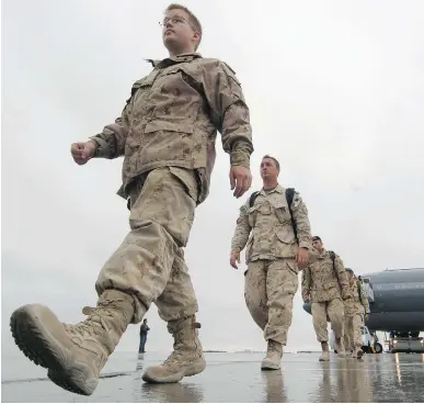  ?? JEAN LEVAC/ OTTAWA CITIZEN FILES ?? Canadian soldiers return from Afghanista­n, a deployment every bit as dangerous as the Iraq War.