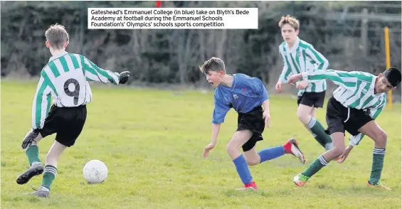  ??  ?? Gateshead’s Emmanuel College (in blue) take on Blyth’s Bede Academy at football during the Emmanuel Schools Foundation’s’ Olympics’ schools sports competitio­n