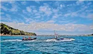  ?? — AFP ?? Engineers guide the Mayflower 400 autonomous trimaran towards Turnchapel Wharf following a sea trail in Plymouth, south west England.