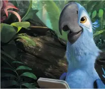  ??  ?? Gabi ( Kristin Chenoweth), a poisonous frog, has eyes only for Nigel the cockatiel in Rio 2. Blu, right, ( Jesse Eisenberg) loves the exotic sounds of the jungle.