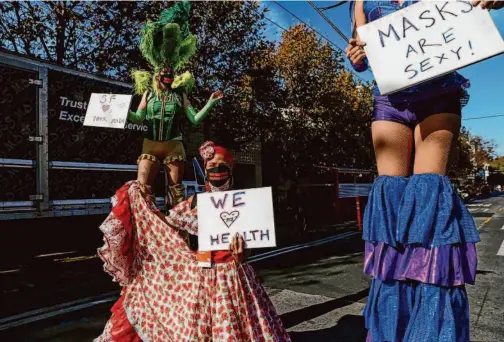  ?? Gabrielle Lurie/The Chronicle ?? Robin Lara, Aura Barba and Stella Adelman perform in 2020 as part of the San Francisco Creative Corps, a pandemic project that paid artists as community health ambassador­s. That project evolved into the California Creative Corps.