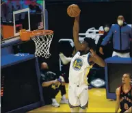  ?? NHAT V. MEYER — BAY AREA NEWS GROUP ?? The Warriors’ James Wiseman (33) dunks the ball against the Raptors in the first quarter at Chase Center on Jan. 10.