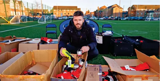  ?? RYAN BROWNE ?? Giving back: Carrick hands out boots as part of a community event on Teesside for the EFL’s Week of Action