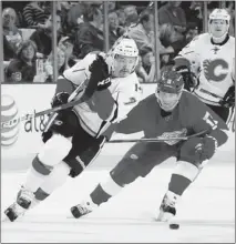  ?? Getty Images file ?? Former Leamington Flyer T.J. Brodie, left, battles Detroit’s Daniel Cleary during a game at Joe Louis Arena last season.