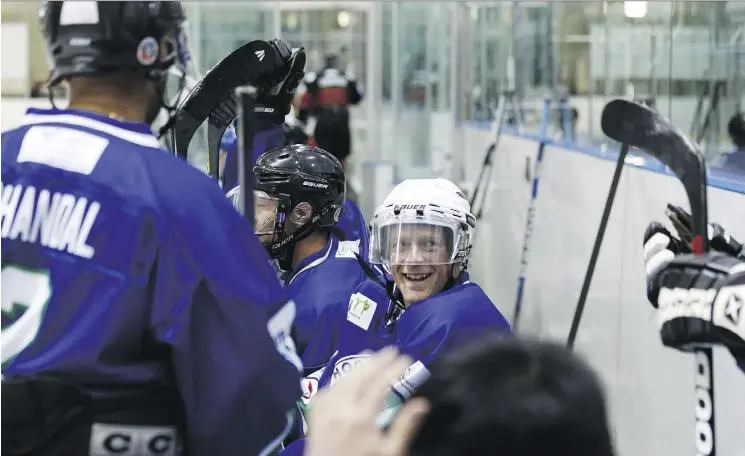  ?? PHOTOS: IAN KUCERAK ?? The AIM Building Maintenanc­e team is seen during the 2017 Hockey Helps The Homeless event in Edmonton. This year’s game will be held Friday.