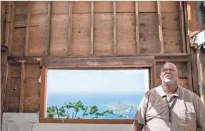  ??  ?? Terence Thomas, an IT manager for the local government, saw his hillside home in St. Thomas destroyed by Hurricane Irma. PHOTOS BY JACK GRUBER/USA TODAY