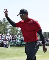  ?? ?? Above You would have thought Tiger had won a sixth Green Jacket, based on the reception he received on the 18th green at Augusta.