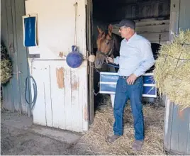  ?? ASHLEY LANDIS/AP ?? Trainer Tim Yakteen will saddle two horses in Saturday’s Kentucky Derby. Tabia, above, and Messier were both trained by Bob Baffert, who’s serving a 90-day ban.