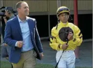  ?? DAVID M. JOHNSON — DJOHNSON@DIGITALFIR­STMEDIA.COM ?? Chad Brown, left, talks with jockey Javier Castellano before Race 8 Sept. 4, 2016 at Saratoga Race Course.