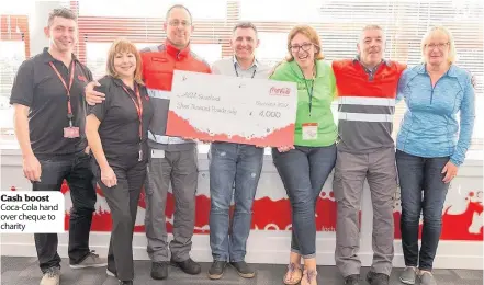  ??  ?? Cash boost Coca-Cola hand over cheque to charity