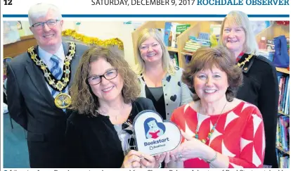  ??  ?? ●Librarian Irene Reachy receives her award from Sharon Palmer-Johnston of BookStart watched by mayor Coun Ian Duckworth, Vicky Clarke, council libraries manager and mayoress Christine Duckworth