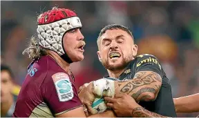  ?? GETTY IMAGES ?? Reds’ Fraser McReight, left, and Hurricanes’ TJ Perenara compete for the ball during Saturday night’s Super Rugby match in Melbourne.